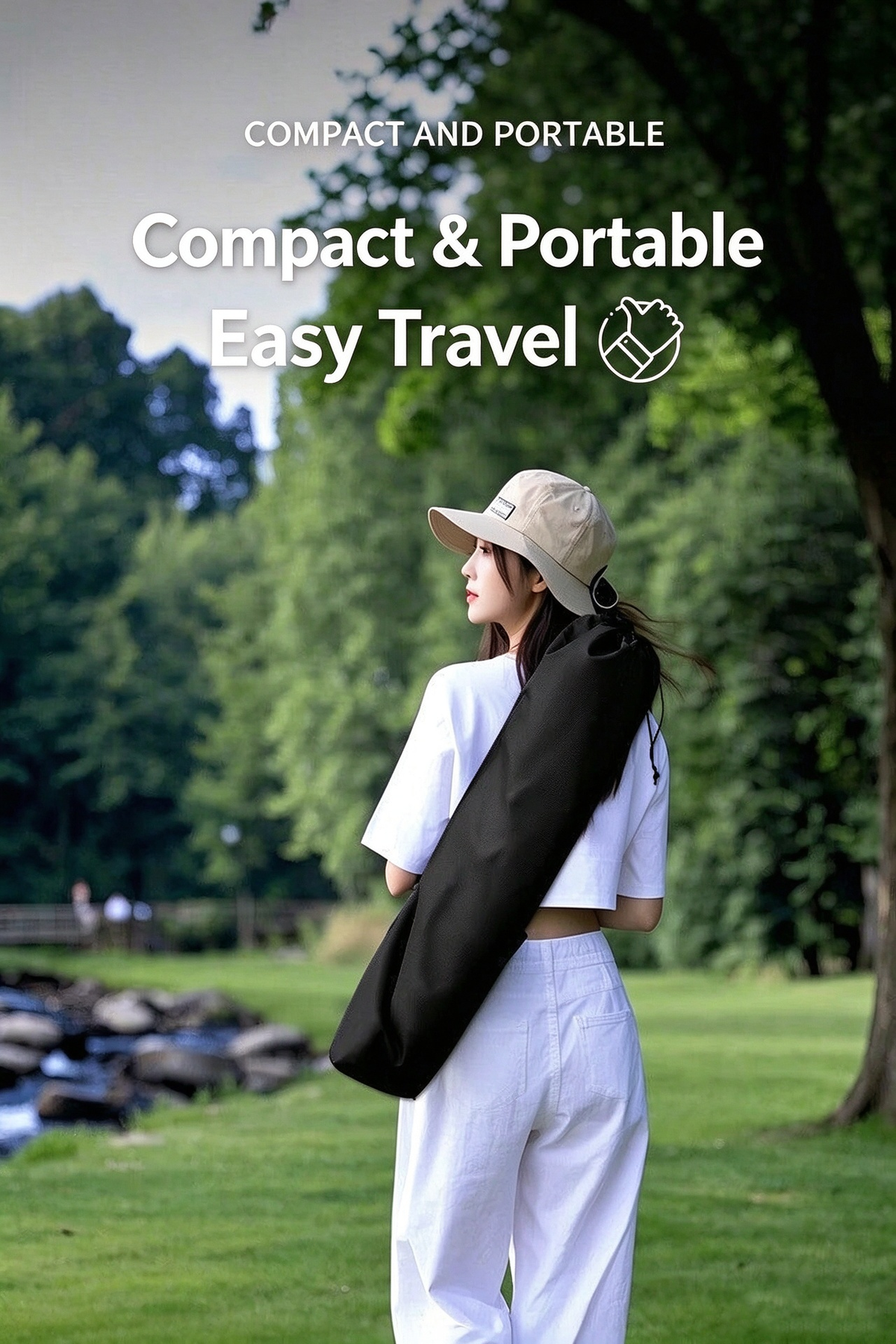 Person carrying the folded camping recliner chair in a compact black shoulder carry bag outdoors